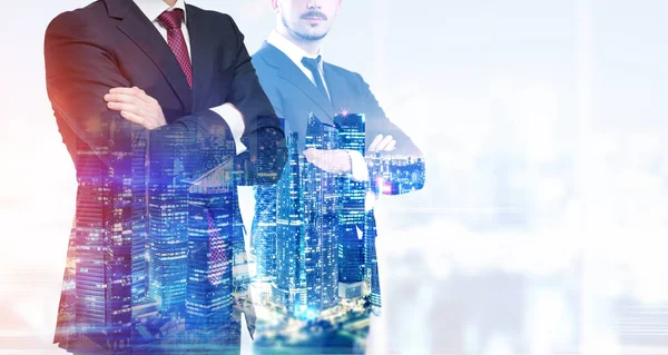Close up of business partners in office with night cityscape — Stock Photo, Image