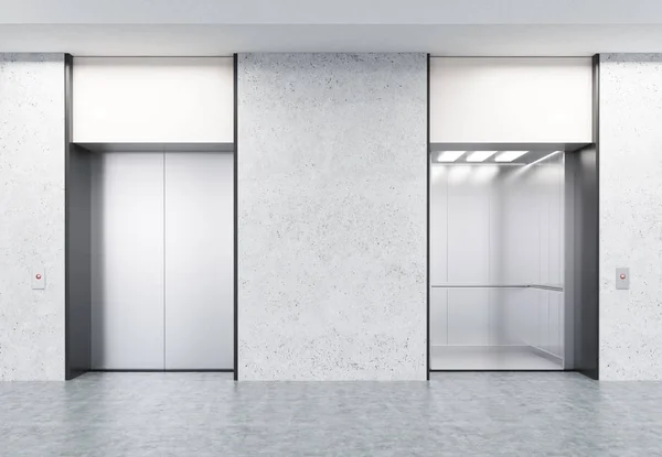 Two closed and open elevators in corridor with concrete walls