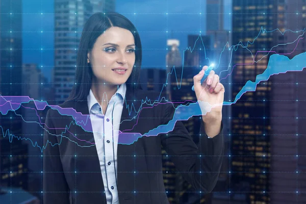 Close up of businesswoman drawing graphs against a night city vi — Stock Photo, Image