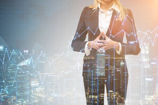 Blond businesswoman in morning city with blue graphs — Stock Photo, Image