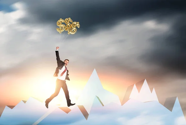 Businessman jumping for dollar signs — Stock Photo, Image