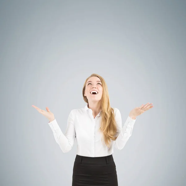 Blond woman happy because of an invisible rain — Stock Photo, Image
