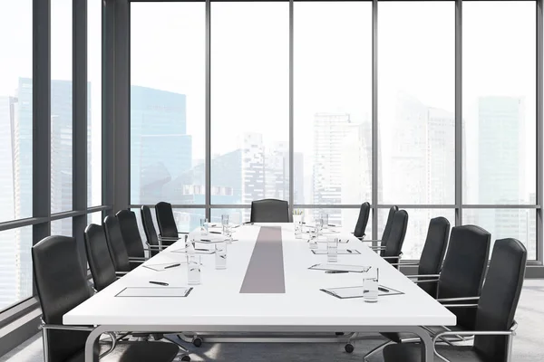 Long conference room table in panoramic windows room