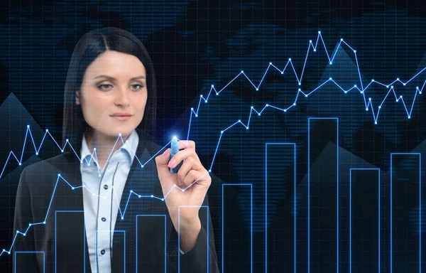 Close up of businesswoman drawing graphs against a world map — Stock Photo, Image