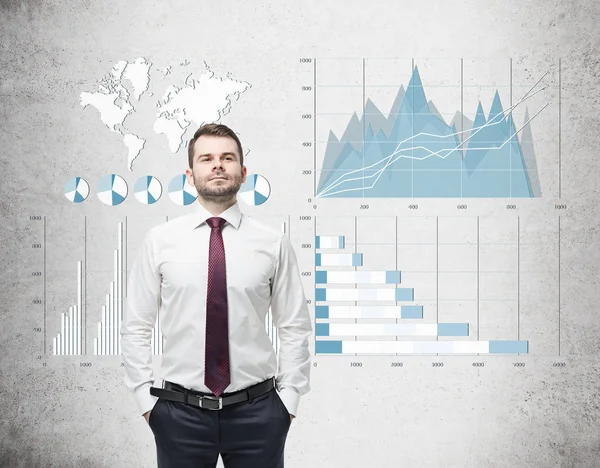 Selbstbewusster Geschäftsmann mit roter Krawatte und blau-weißen Grafiken auf Co — Stockfoto