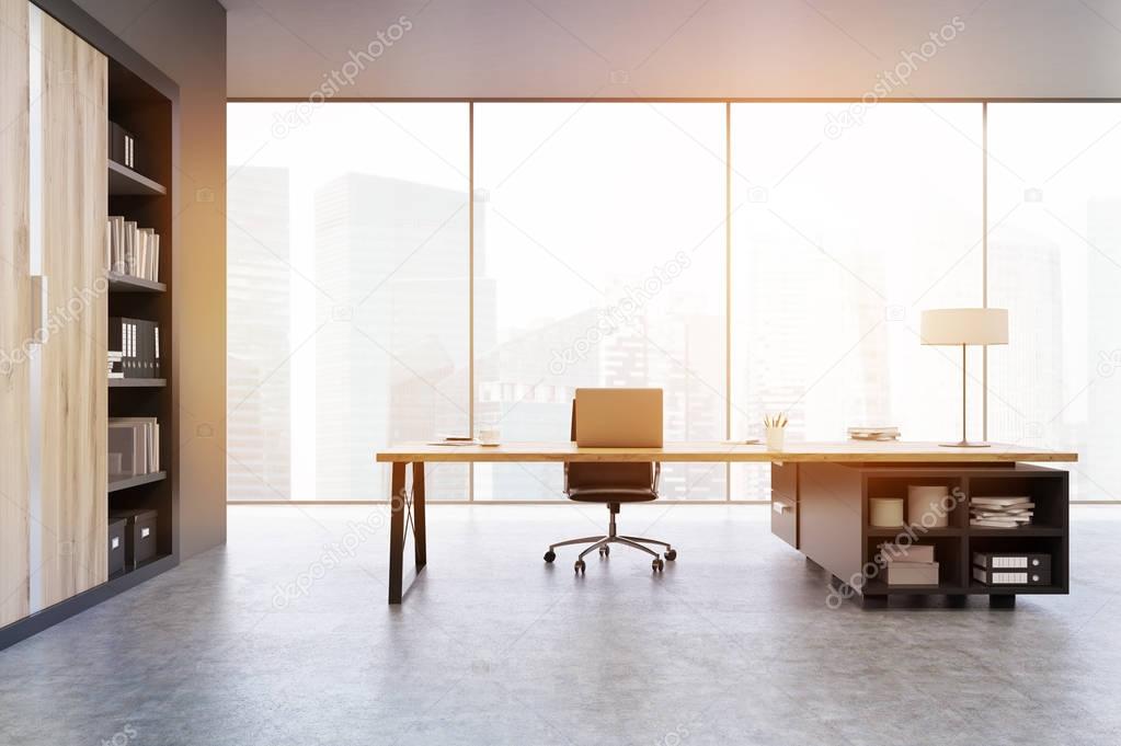 View of a CEO office with wooden doors and a bookcase, toned