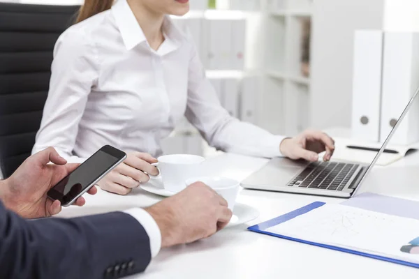 Close up of woman in white blouse and her coworker in office — Stock Photo, Image