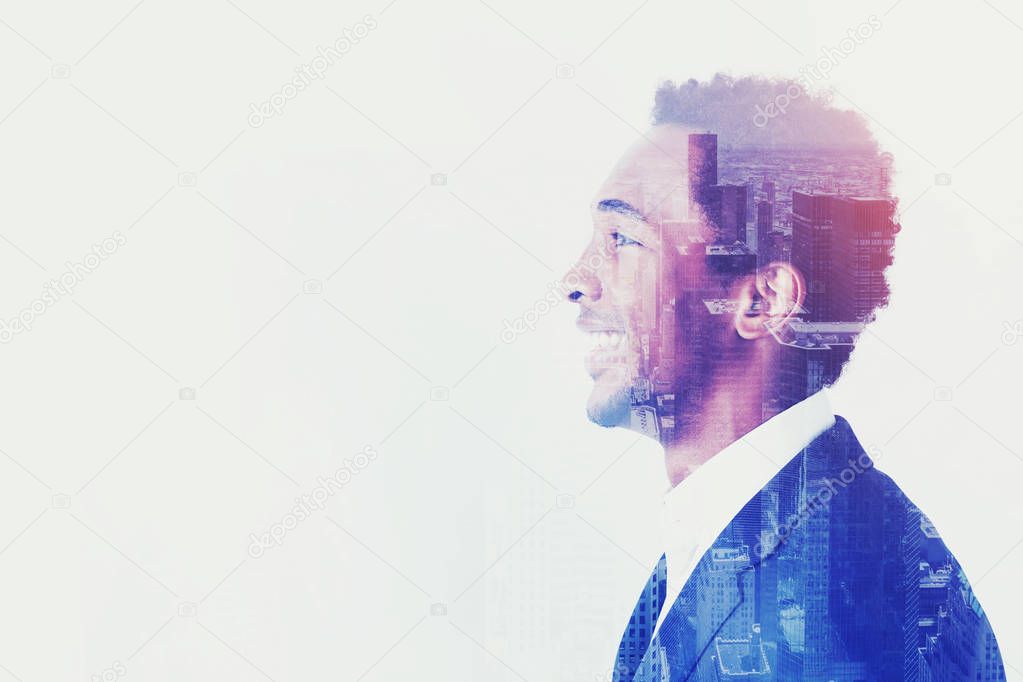 Side view of African businessman, looks forward