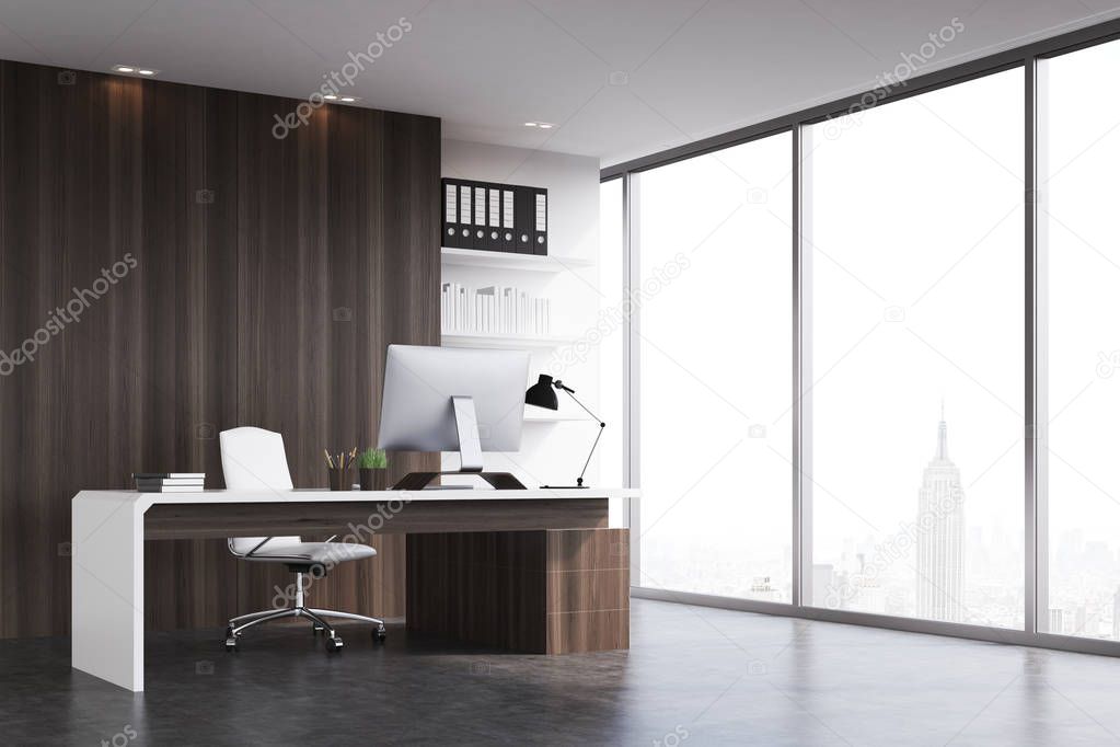 Office of the company head with dark wood walls