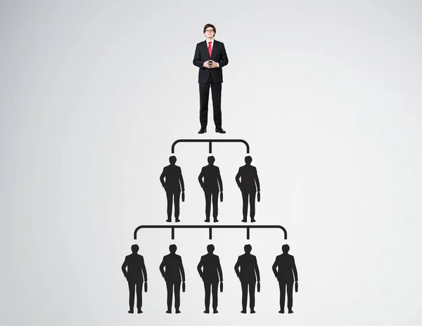 People pyramid with leader in red tie — Stock Photo, Image