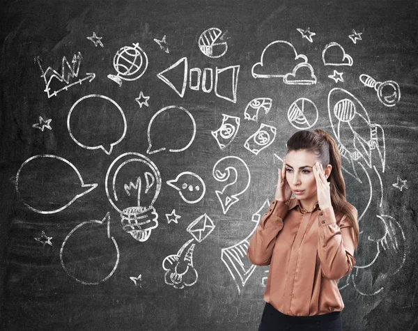 Stressed woman and a project sketch — Stock Photo, Image