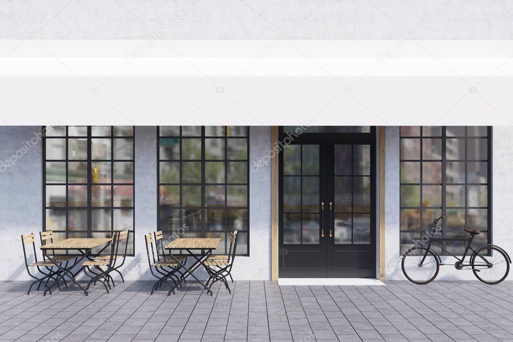 Cafe exterior with tables and bike