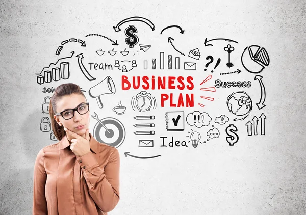 Thinking woman in glasses and business plan — Stock Photo, Image