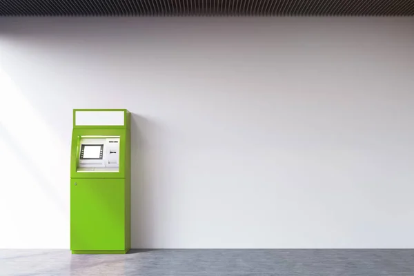 Grön bankomat nära betongväggen — Stockfoto