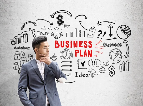 Asian businessman, red and black business plan — Stock Photo, Image