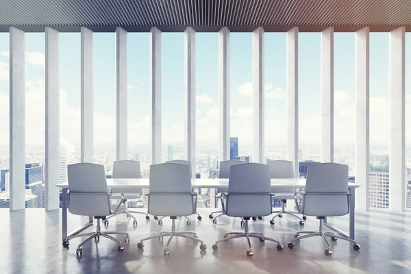 Conference room: narrow shades on the window. City