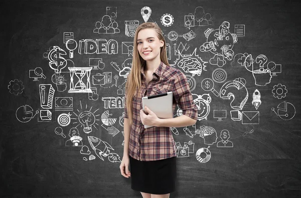 Girl in checkered shirt and business idea sketch — Stock Photo, Image