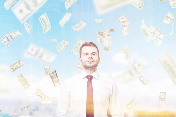 Confident man and a dollar rain in a city — Stock Photo, Image