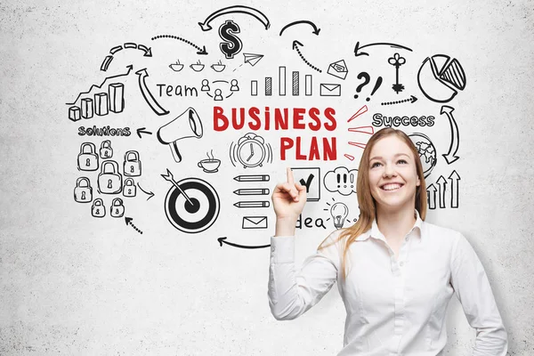 Cheerful blond woman and a business plan sketch — Stock Photo, Image