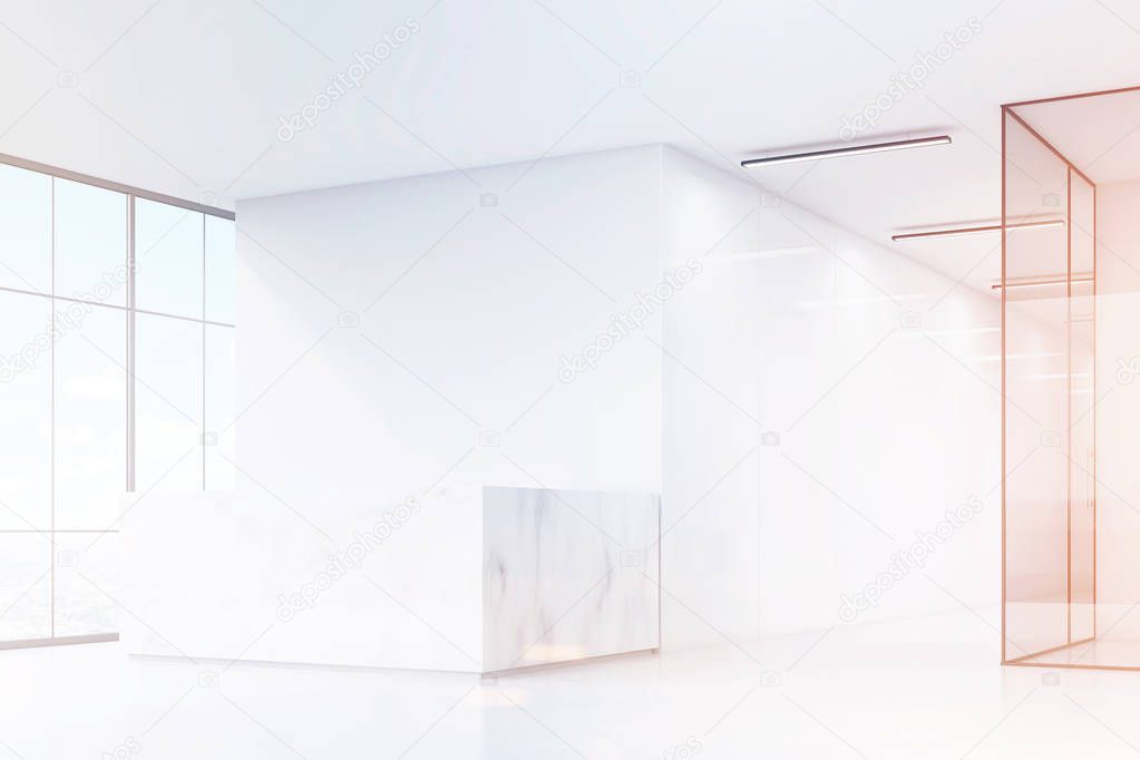 Corner of white office with marble desk