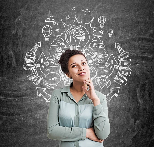 African American woman and a plan sketch — Stock Photo, Image