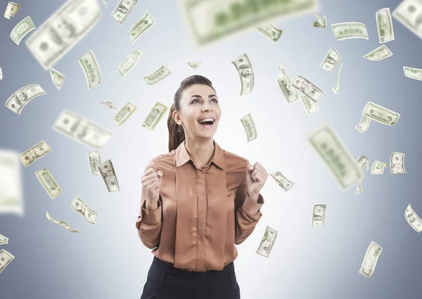 Woman in brown and dollar rain — Stock Photo, Image