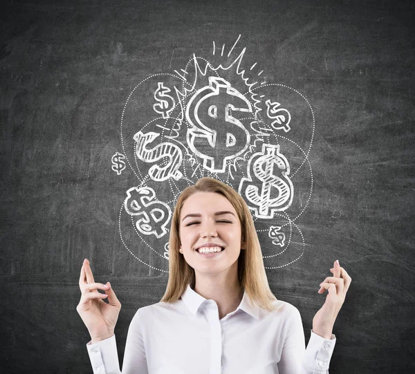 Femme avec les doigts croisés et des signes de dollar brillant — Photo