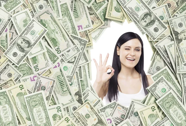 Girl with ok sign in a dollar frame — Stock Photo, Image