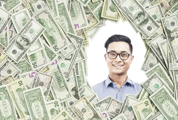 Азиатский бизнесмен в долларовой рамке — стоковое фото