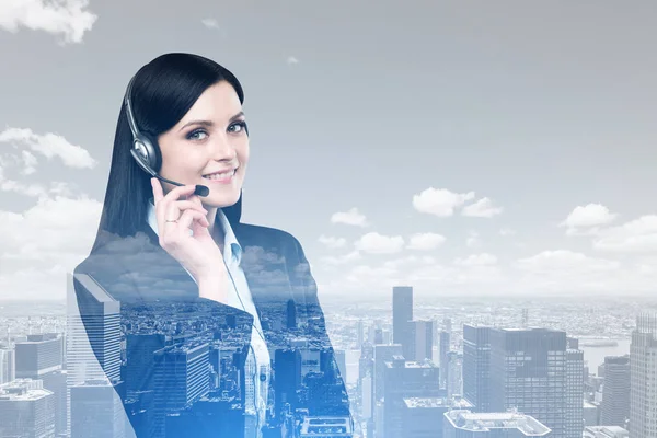 Woman with headset and a city — Stock Photo, Image