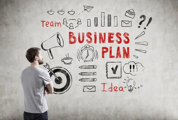 Man in T-shirt and business plan icons — Stock Photo, Image