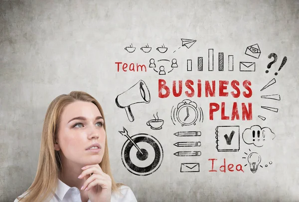 Pensive blond woman and business plan. — Stock Photo, Image