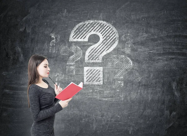 Woman in dress and big question mark on blackboard — Stock Photo, Image