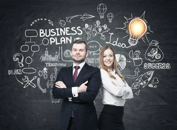 Bearded man and woman near business plan — Stock Photo, Image