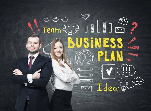 Bearded man and woman near bright business plan — Stock Photo, Image