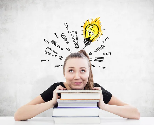 Girl with books has an idea — Stock Photo, Image