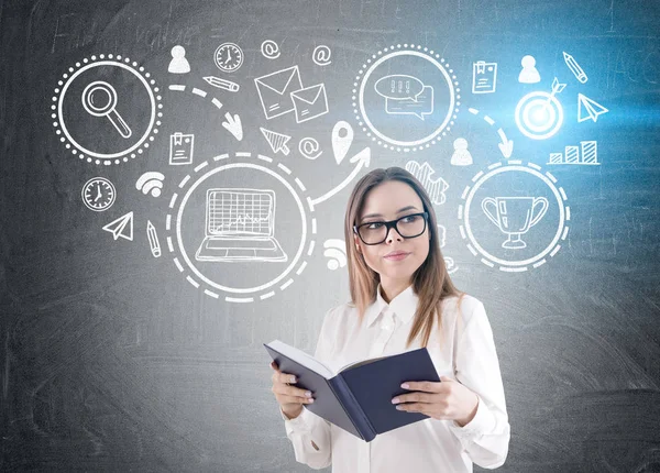 Geek girl with book and trophy icons, toned — Stock Photo, Image