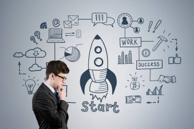 Düşünme genç işadamı ve roket