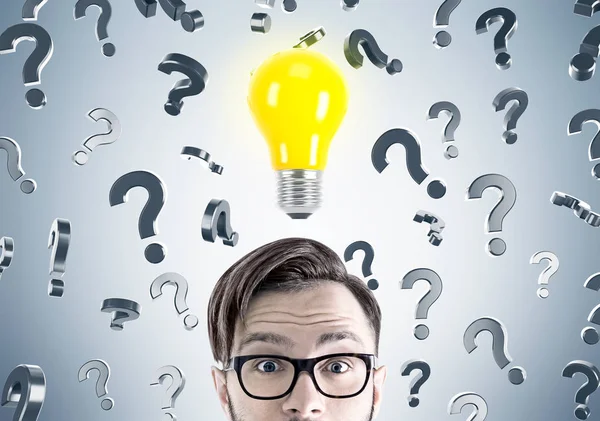 Hipster businessman, questions and light bulb — Stock Photo, Image