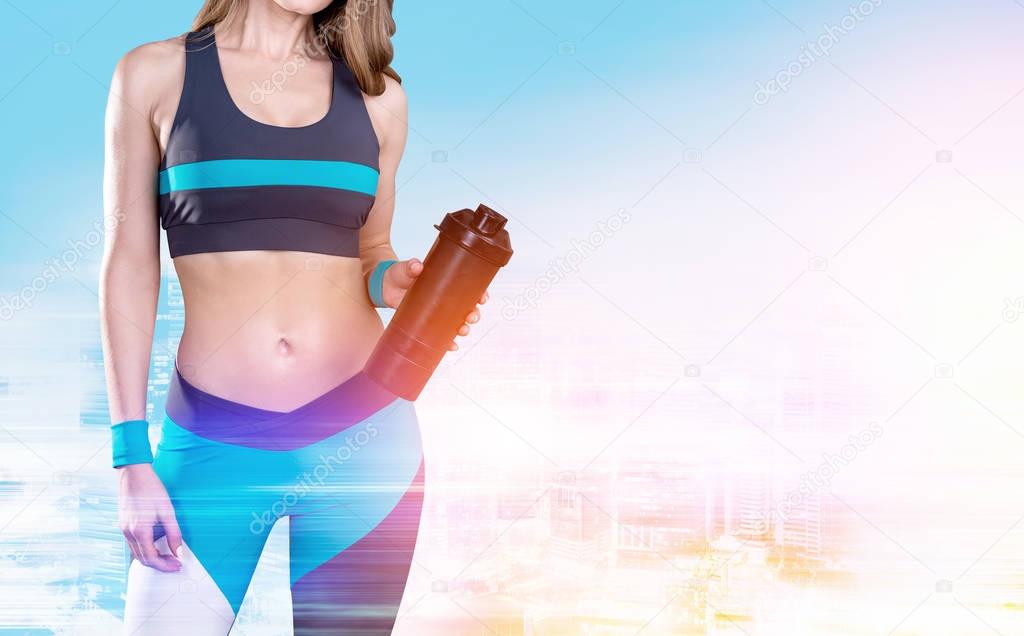 Woman with yoga mat and morning city