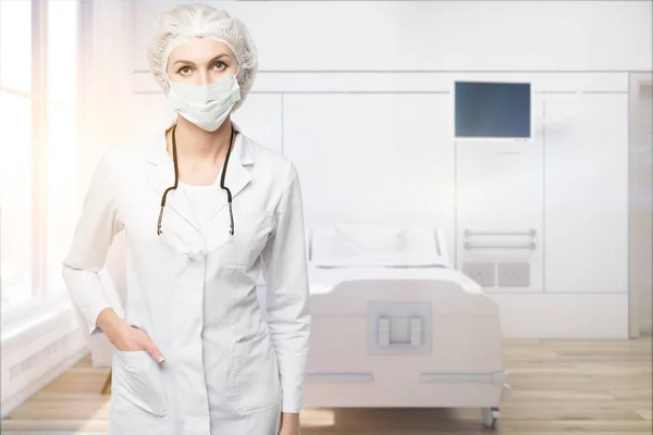 Woman doctor in a beige ward, front