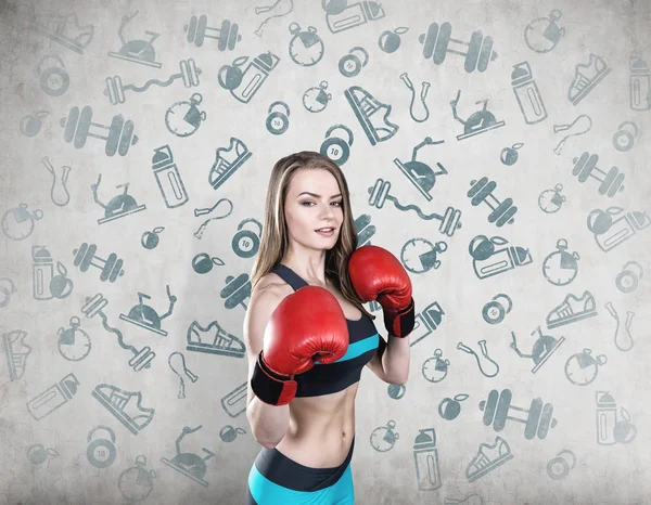 Boxerin in Blau und Sport-Ikonen — Stockfoto