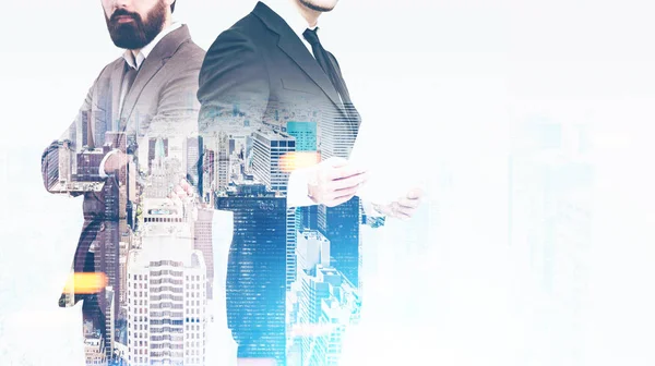 Business duo and a city — Stock Photo, Image