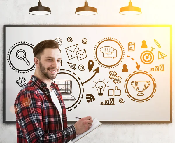 Hipster kerel en een trofee schets op whiteboard — Stockfoto