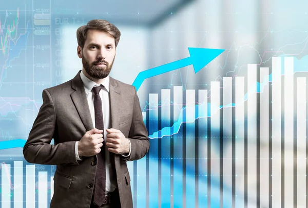 Man with beard and graphs in office — Stock Photo, Image