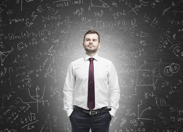 Confident man near a blank blackboard