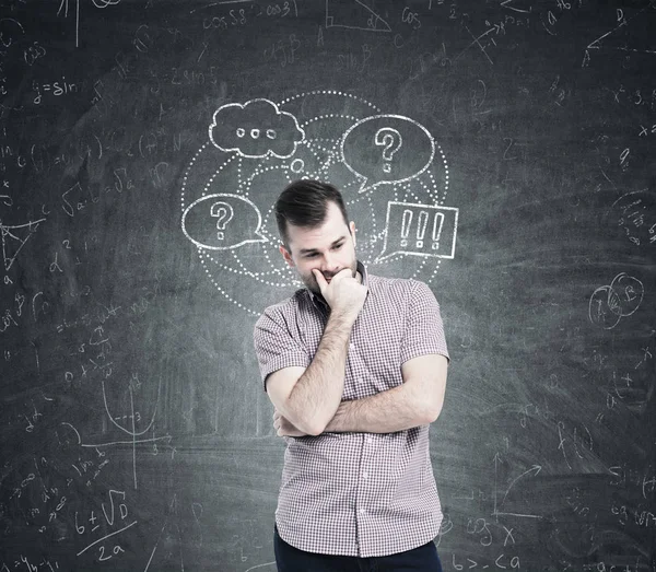 Man in pink and speech bubbles, blackboard — Stock Photo, Image