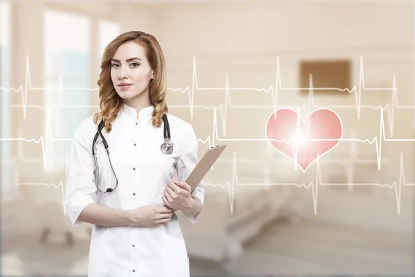 Woman doctor in a ward with cardiogram — Stock Photo, Image