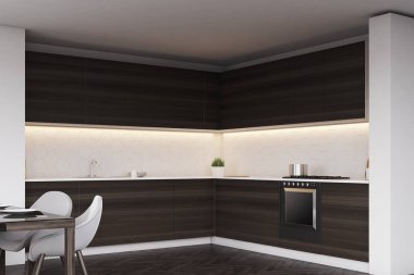 Karanlık mutfak tezgahları ve bir tablo, köşe