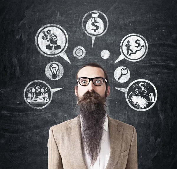 Hombre con barba larga e iconos de dinero —  Fotos de Stock